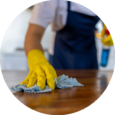 a person cleaning a table