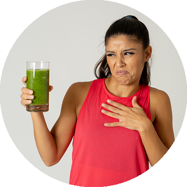 woman holding green health drink